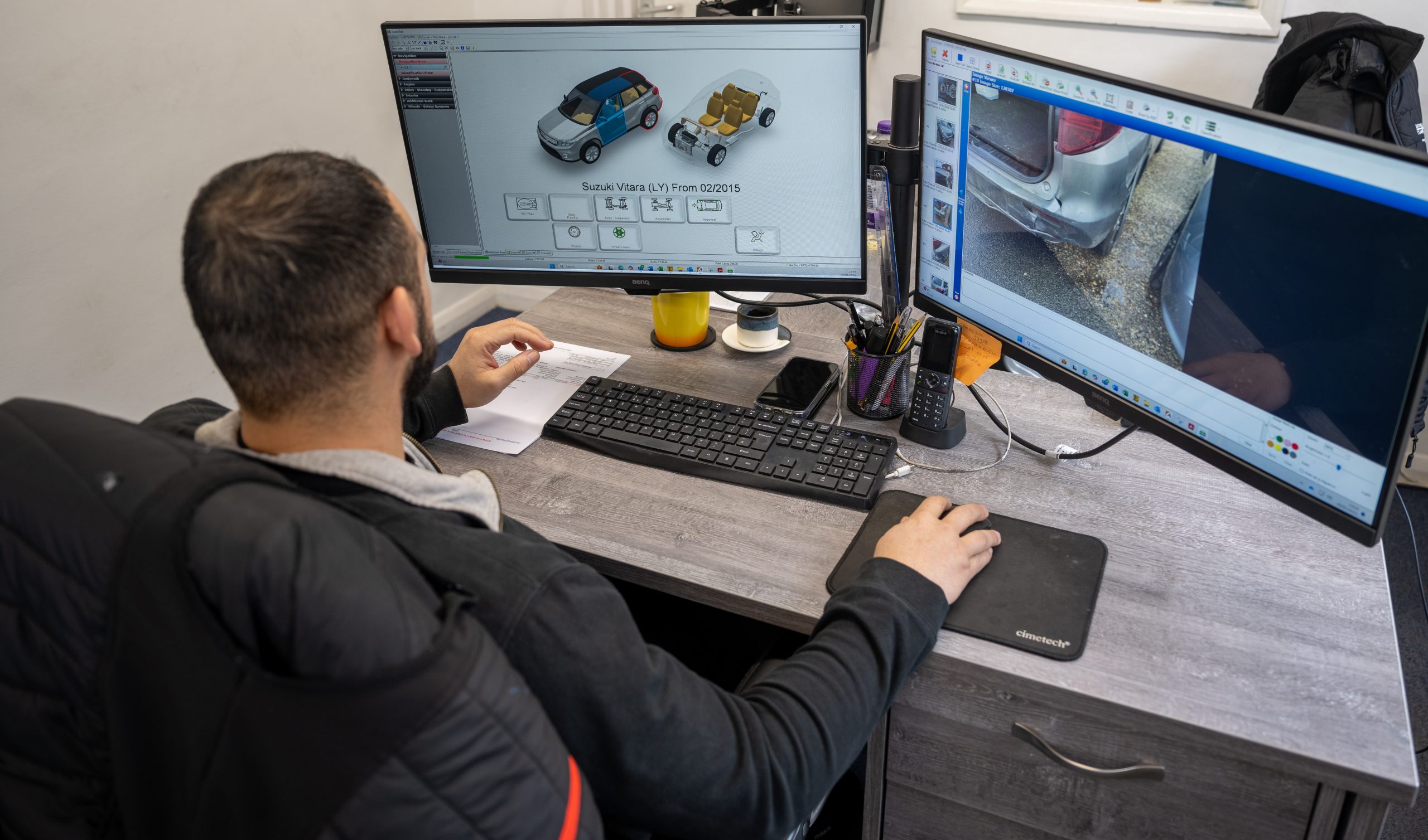 A Sandown Coachworks estimator using Audatex software to create a precise digital repair plan for a Suzuki Vitara.