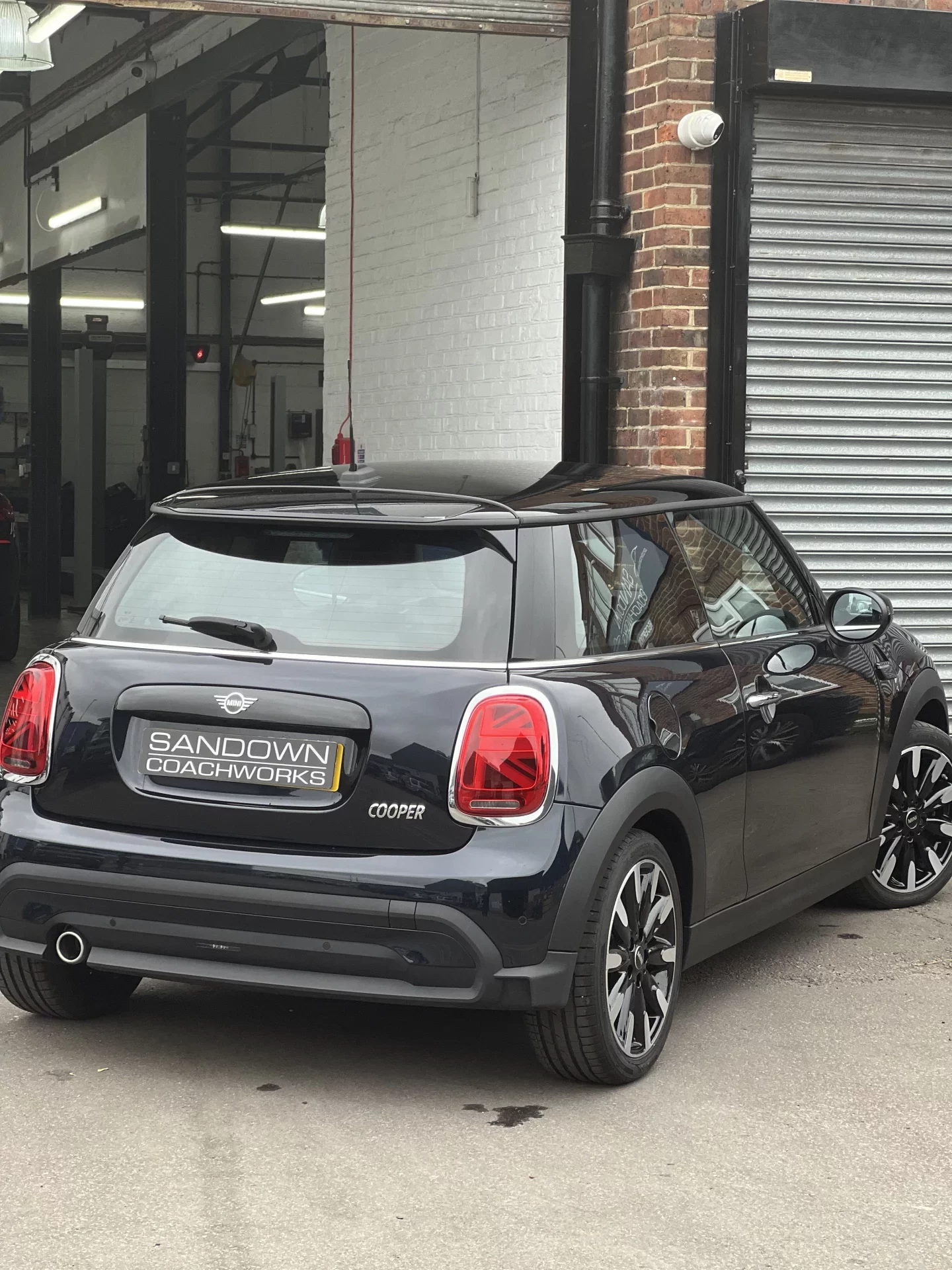 The finished repair project parked at the Sandown Coachworks reception, showing a high-gloss finish and perfect panel alignment.